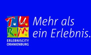 Logo T.U.R.M. ErlebnisCity Oranienburg mit Slogan Mehr als ein Erlebnis