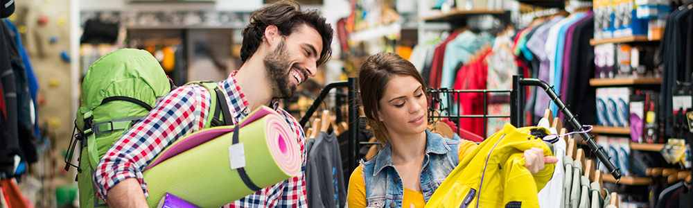 Man and woman shopping in a sports shop - symbolises the process behind where EDI for Sport 2000 comes into play.